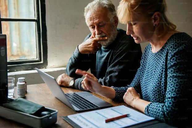 An older adult understanding Medicare supplement insurance in Fresno with a professional advisor