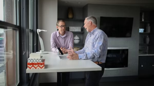 Senior reviewing Medicare plan options with an insurance agent in California