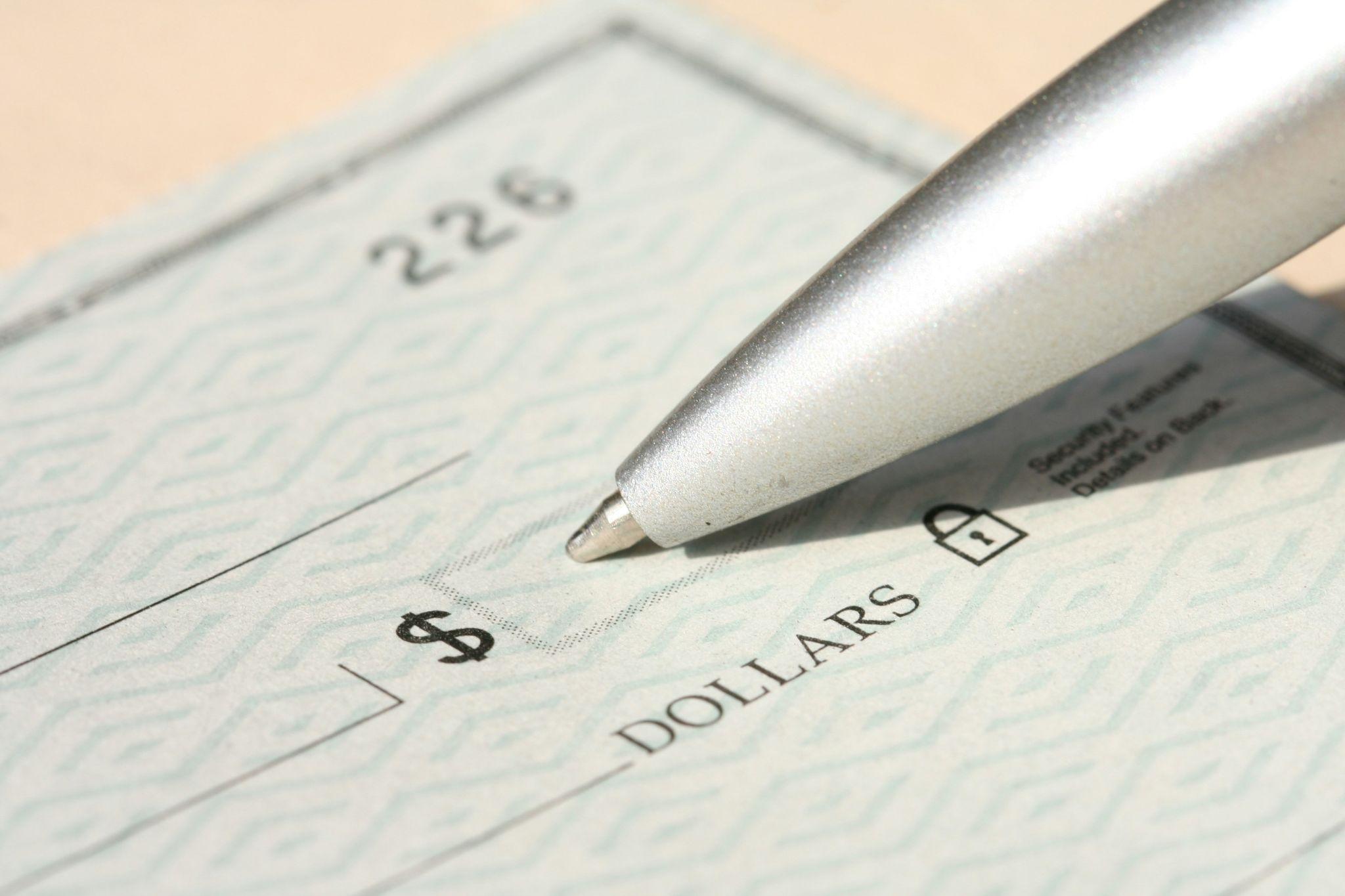 A check representing financial planning for burial insurance in California to help cover end-of-life expenses