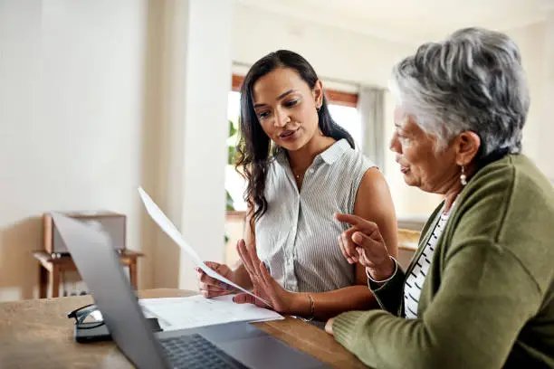Senior discussing term life insurance options with a senior life insurance agent in California.